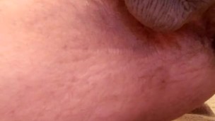 Muscle bear spits on cock and shoots a thick load!