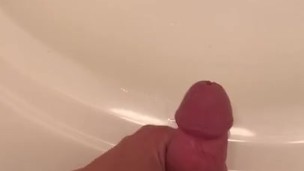 Stroking out a piss in the sink