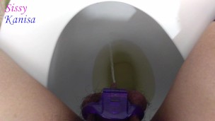 SisK piss through tiny purple chastity cage