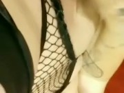 Goth girl in fishnets plays with her fat pussy