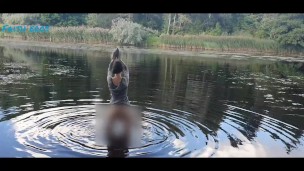 Squatting Nude On The River While Reading