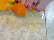 Orange crushed by virgin feet 