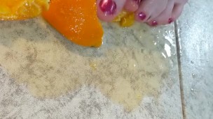 Orange crushed by virgin feet 