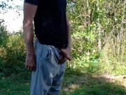 Country boy pissing in a park