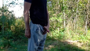 Country boy pissing in a park