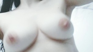 Bouncing my pale natural boobs from a funny angle.