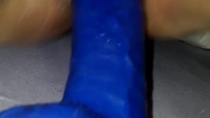 Riding big blue dildo