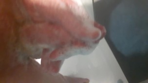 Stroking my small soapy cock in the shower 