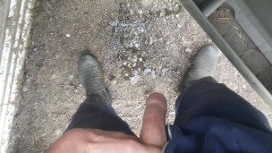 Lad taking a piss in gumboots pov
