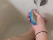 Girl washing sore feet and ankles after working long shift 14/16