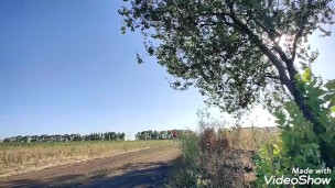 Locked in chastity cage cyclist man is pissing outdoor