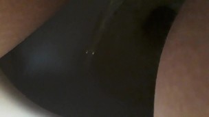 Wet loud peeing in public toilet close up