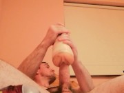 Lying on the bed and fucking a Fleshlight in cowboy position 7/16