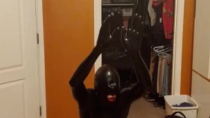 Performing exercises for Sir while plugged, in chastity and in skintight rubber head to toes