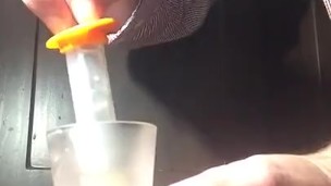 loading a syringe of my thawed cum loads to inject into my wife's pussy 