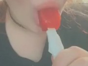 cutie sucks and teases a popsicle 