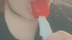 cutie sucks and teases a popsicle 
