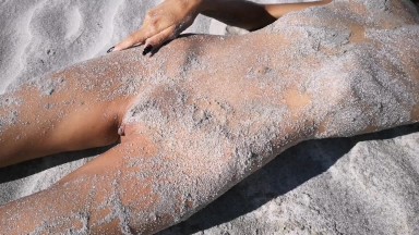 Stranger finds a perfect tanned skinny brunette on a nudist beach and gives her a hot piss