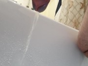 Point of view from the bottom of my cock. Pissing in bathtub.