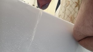 Point of view from the bottom of my cock. Pissing in bathtub.