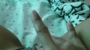 Teen fingers her pussy on camera 