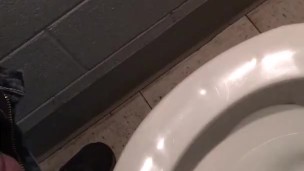 slave peeing in public toilet