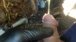 Pov lad unzips and flops it out to take a yellow piss next to muddy tire