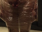 Male slave bound in cling wrap gets riding crop CBT by two gorgeous Femdoms 3/16