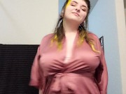 Goth girl gives playful strip tease dance in silk robe  1/16