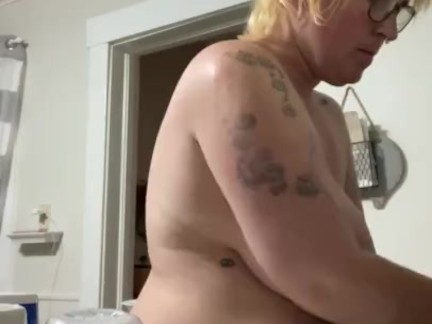 stepmom pretends not to see places by stepson while doing dishes topless thumbnail