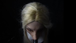 Nun in female mask practices blowjob on strapon