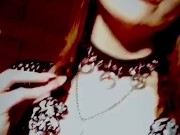 Goth stripper with fangs smoking