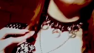 Goth stripper with fangs smoking
