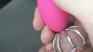 Teasing my locked clit in the car