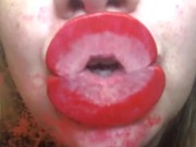 Red lips kissing glass