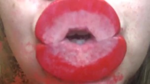 Red lips kissing glass