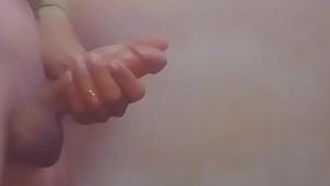Handjob of a guy in bathroom