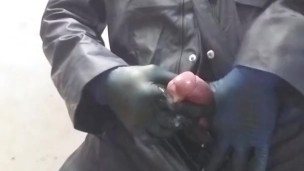 Hunk spews out huge load on the floor, in pvc boilersuit and rubber gloves