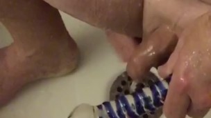Anal addict uses a glass dildo everyday to fuck his ass in the shower. No lube needed, just H20.