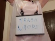 Whore in trash bag drools with humiliation