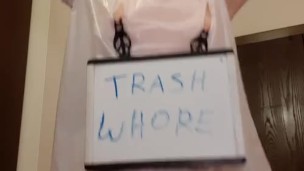 Whore in trash bag drools with humiliation