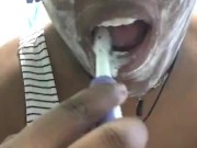 Brushing my teeth and scraping my tongue 