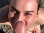 tattooed girl gives blowjob at beach  15/16