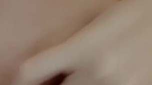 Petite girl plays with tight pussy