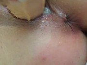Whore gets ass caned while using dildo
