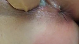 Whore gets ass caned while using dildo