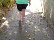 BBW in flip flops walks along the sidewalk while a voyeur peeps on her feet Public foot fetish 9/16