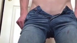 Tan twink rubs his cock 