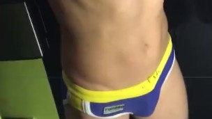 Flexing and showing off in swim trunks