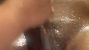 BIG BLACK DICK GETS OILY HAND JOB 